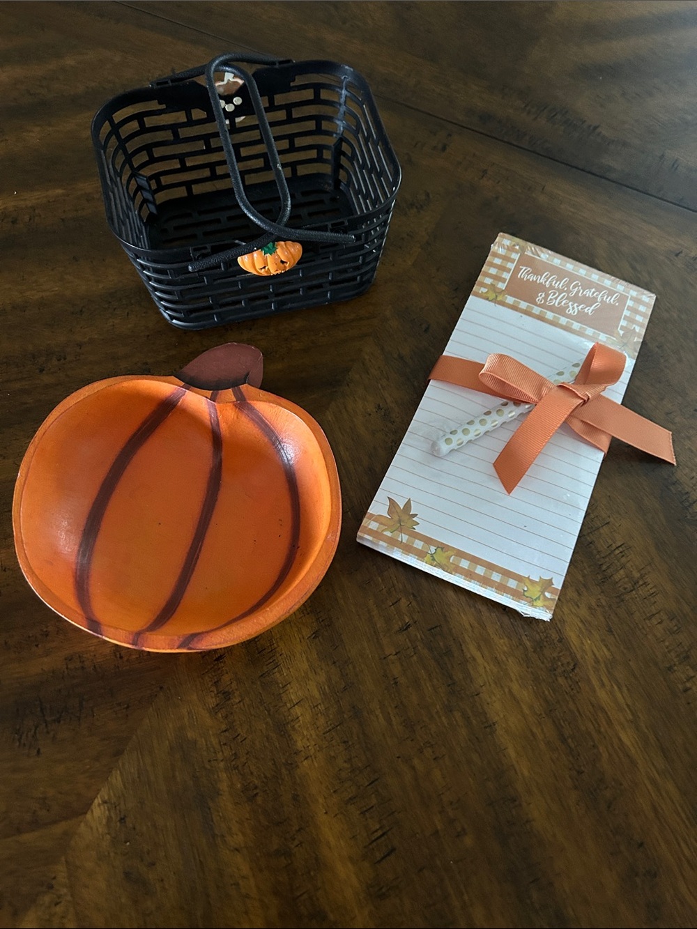 Orange Wooden Pumpkin Bowl; small black basket and Notepad/pen